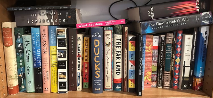 a bookshelf full with a broad variety of books