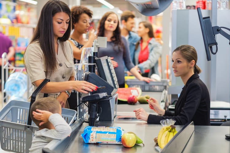 photograph of people in line at a supermarket